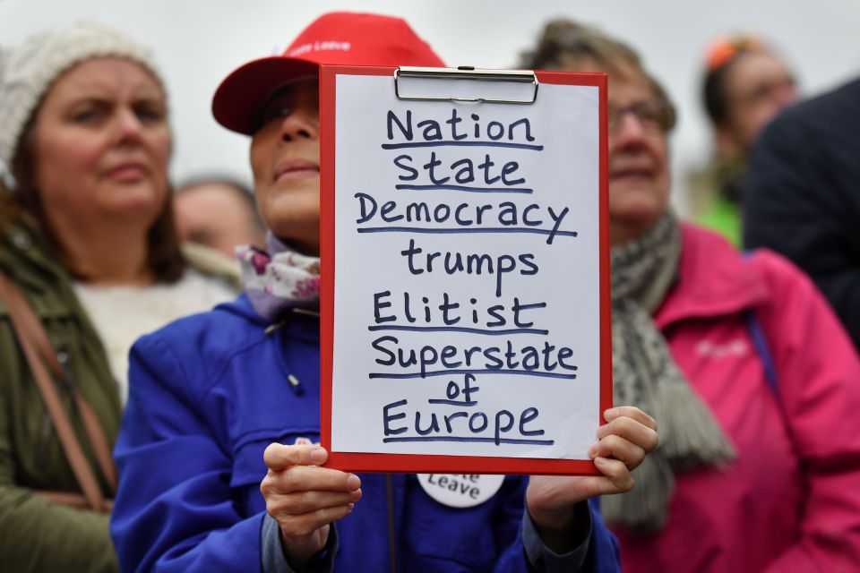 A protestor holds a placard during an an