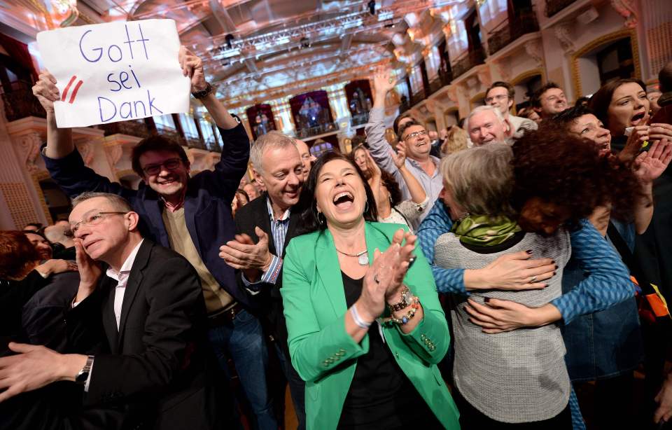 Van der Bellen's supporters cheered and held up a sign saying 'Thank God' as they celebrated in Vienna