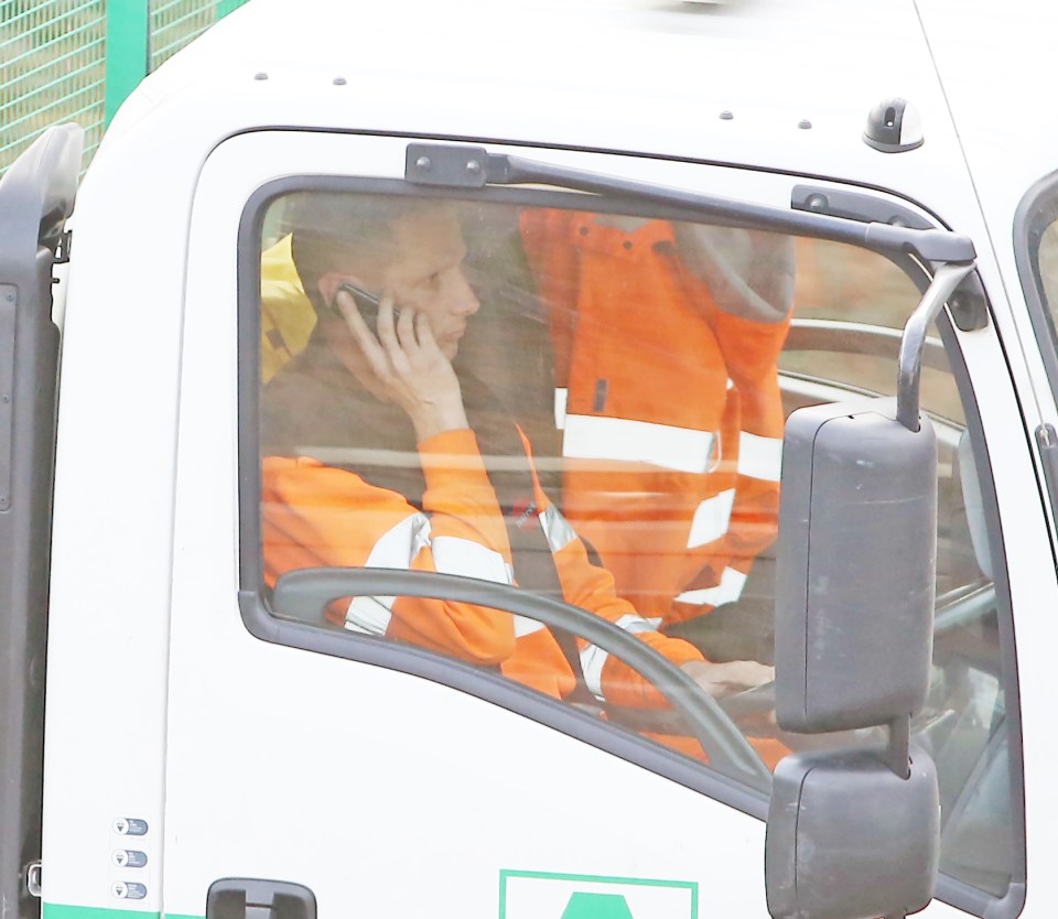 Man in lorry on mobile