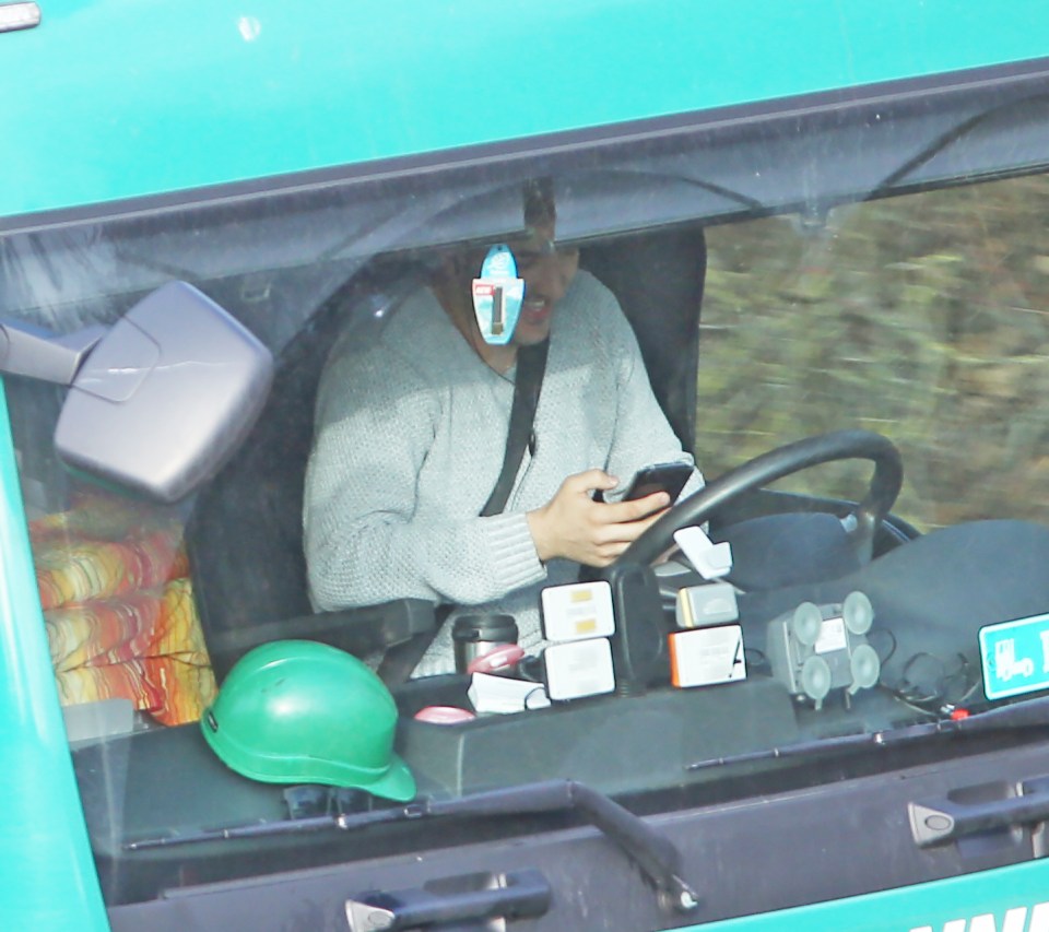 Man in lorry on mobile