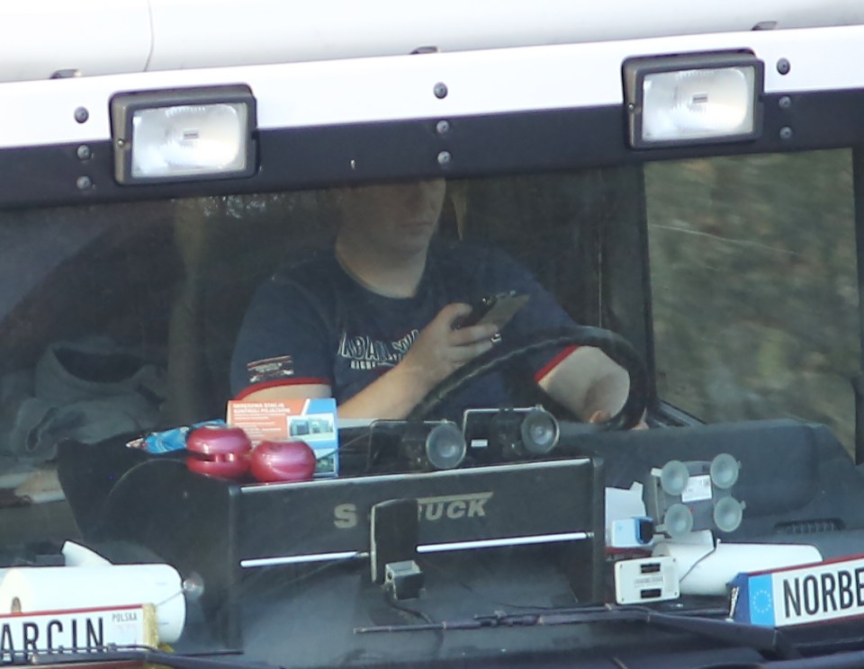 Man in lorry on mobile
