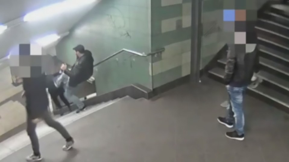 This is the shocking moment a thug kicks a woman in the back sending her flying down the stairs