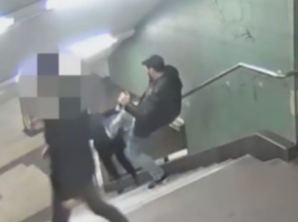 The thug then appears to kick her back sending her flying down the stairs