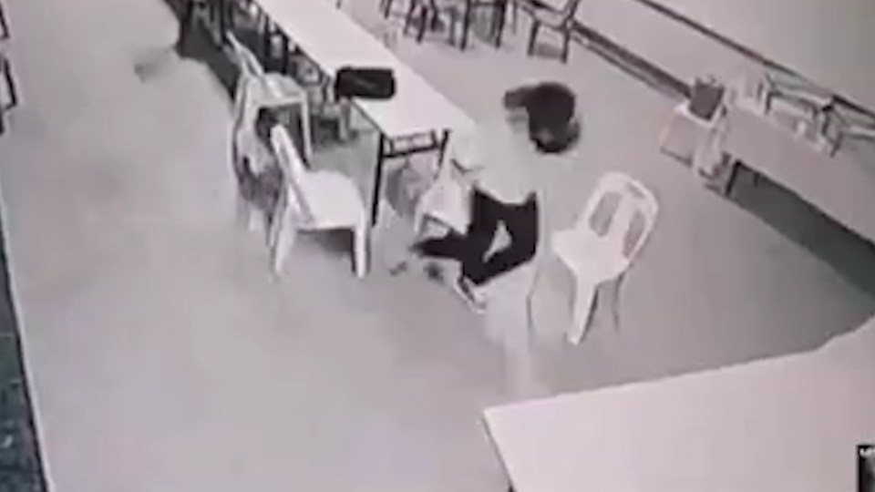 The woman gets up from her chair in utter fright