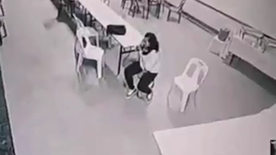 The woman hotel worker is seen relaxing, when suddenly the chair moves 