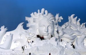 Incredible pictures show 103-metre long ice sculpture as Chinese artists prepare for biggest winter festival in the world