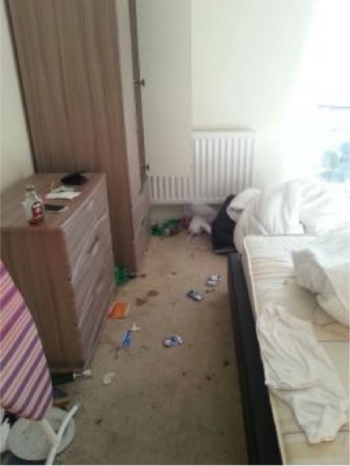  Sheets and rubbish fill the empty room after the party