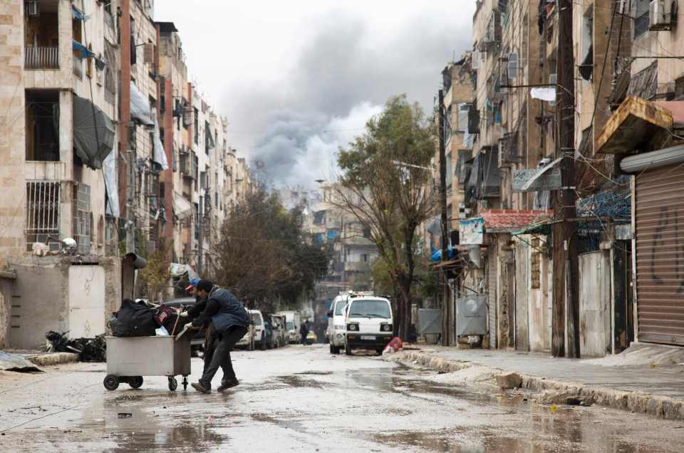 Smoke is seen billowing after an explosion in Aleppo today