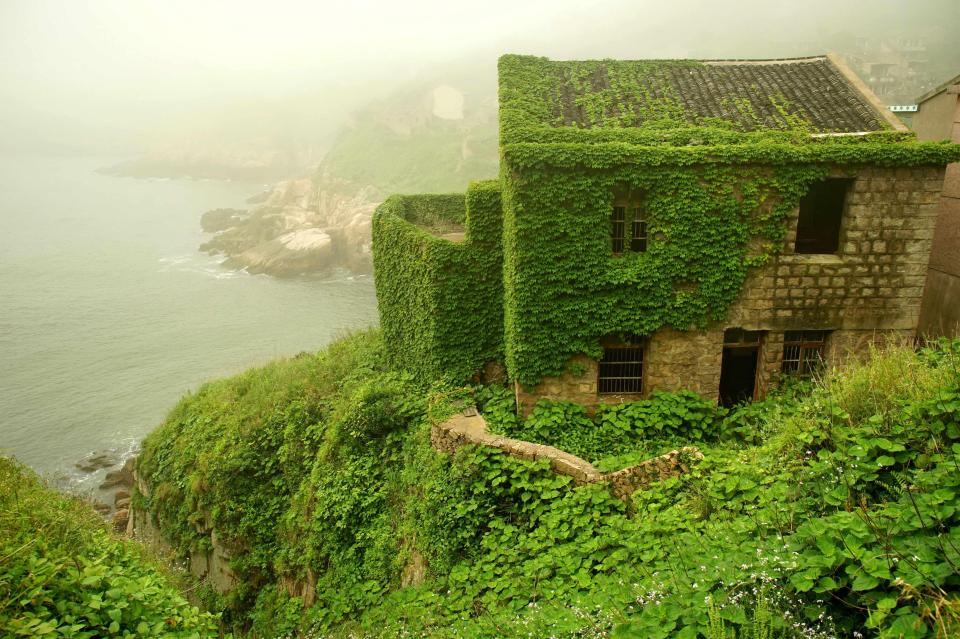  A house stands on a clifftop near the shores of the island, which is one of 394 off the coast of eastern China