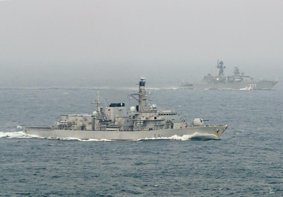 The Royal Navy's Type 23 frigate 'HMS Sutherland' (foreground) escorting the Neustrashimy-class frigate 'Yaroslav Mudryy' (background)