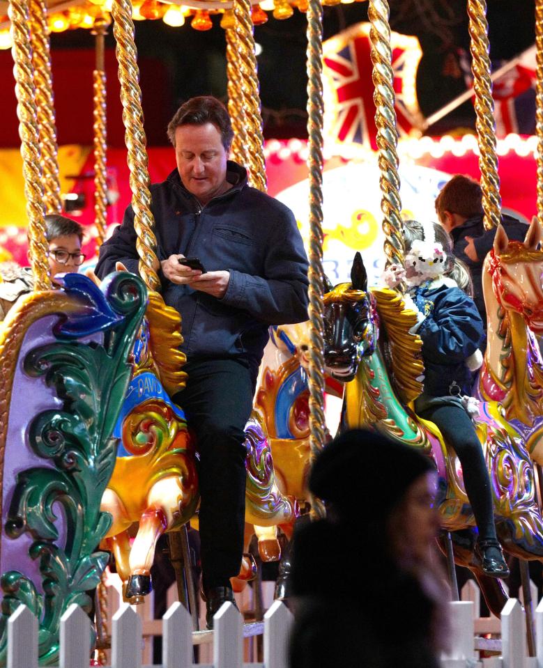At other time however the former PM was seen on the merry-go-round with his daughter Florence, six