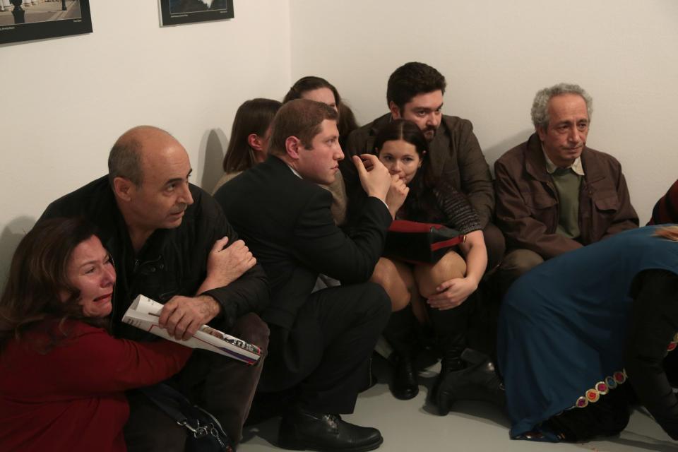 Pepole react after the the Russian Ambassador to Turkey, Andrei Karlov, was shot at a photo gallery in Ankara, Turkey