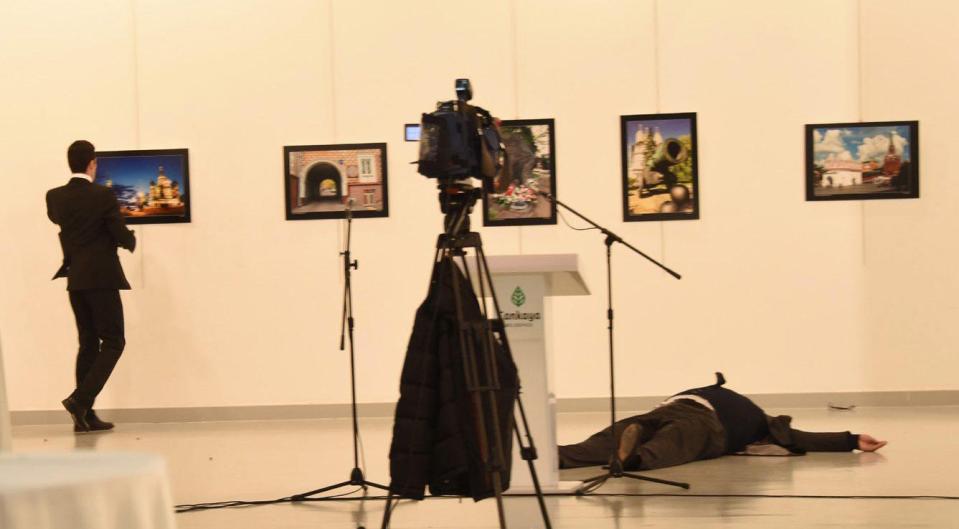 The killer stalked around the podium after his barbaric act