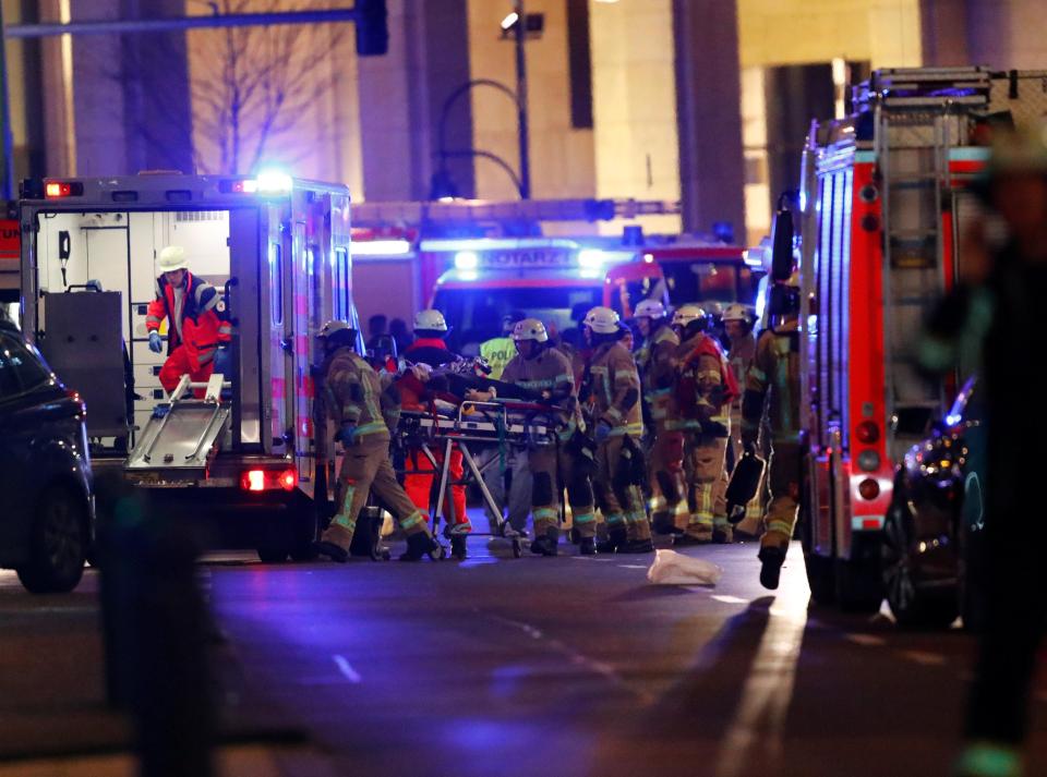 Emergency workers help those injured at the scene