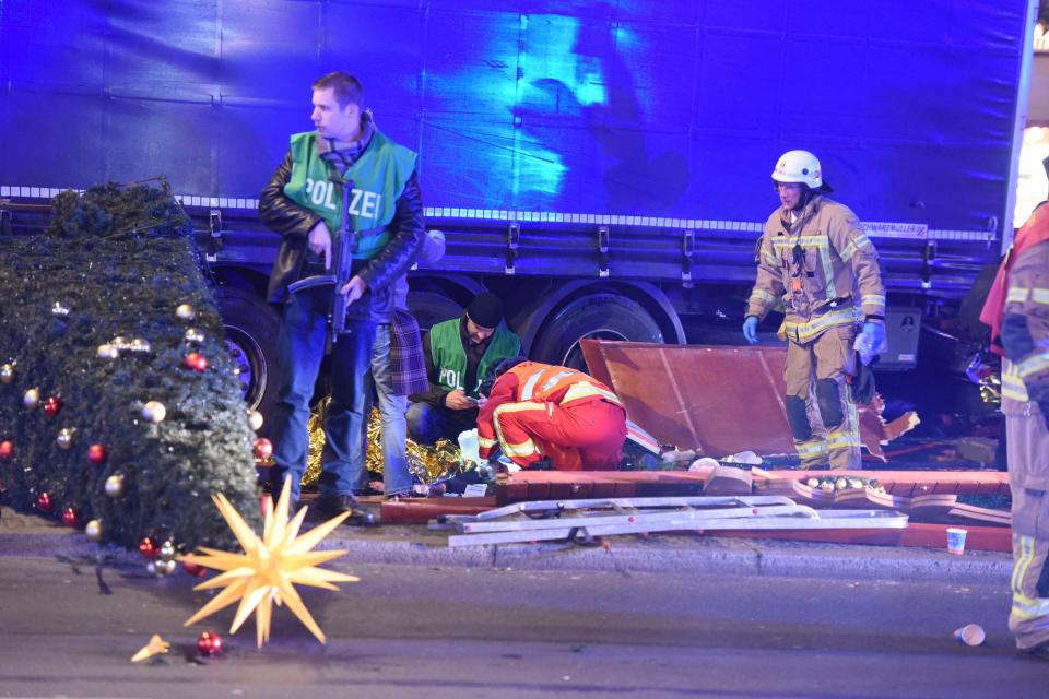  A paramedic treats a casualty at the scene of the horror attack in Berlin last night