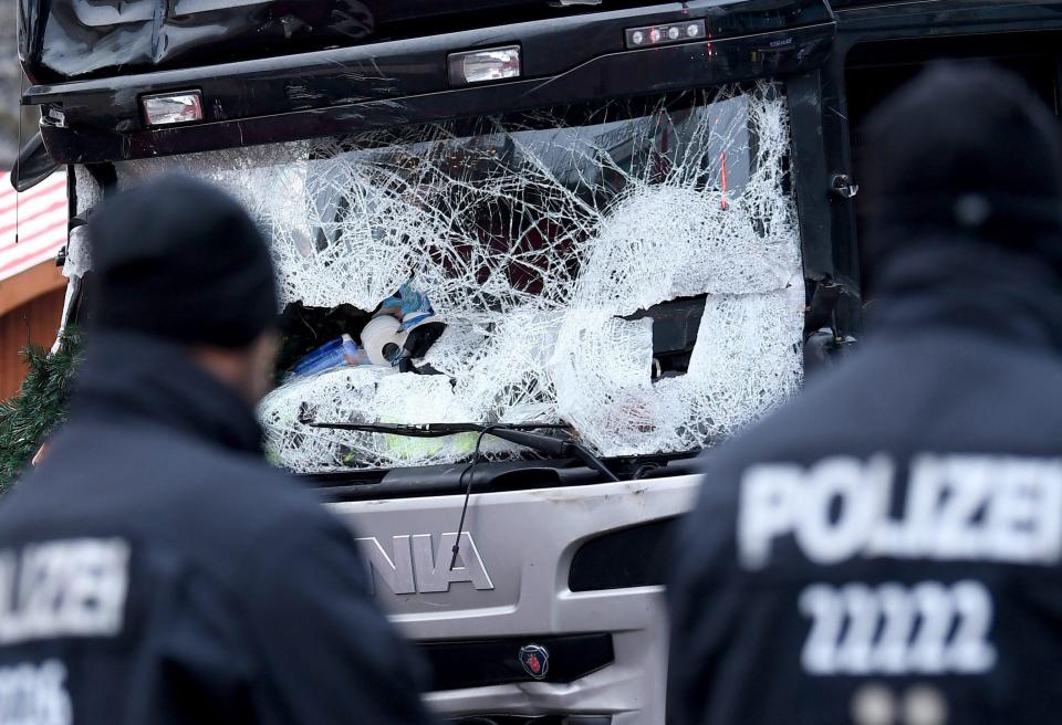  Police surround the truck in Berlin this morning after the rampage last night