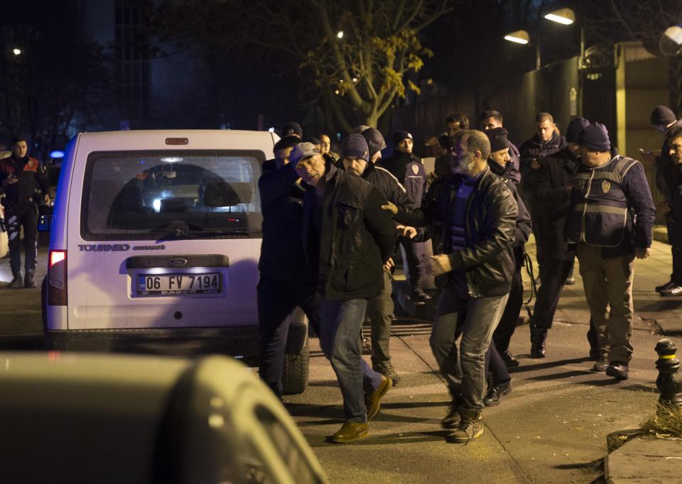 A man was arrested and the US embassy in lock-down hours later as a man fired shots hours after the assassination of the diplomat