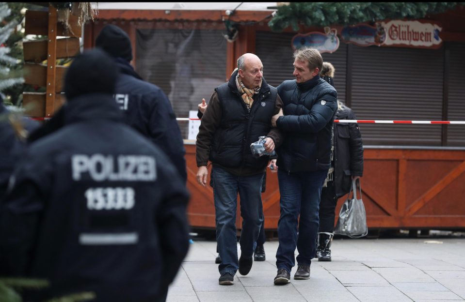  Police accompanied market traders back to their stalls to inspect damage in the wake of rampage
