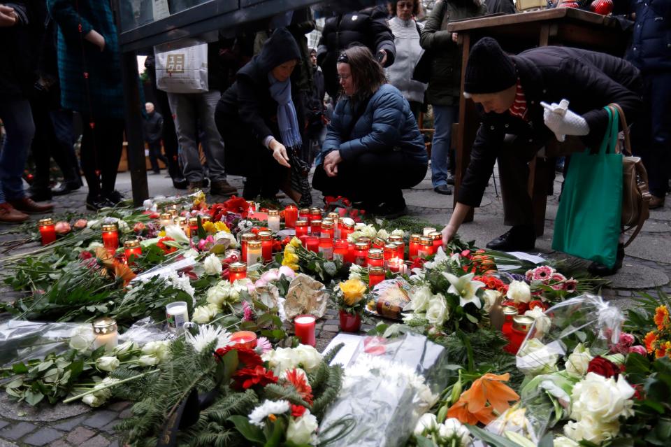  Hundreds of flowers were laid in tribute to those killed in the German capital last night