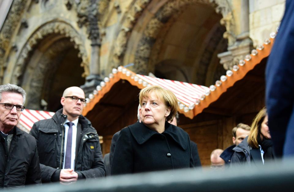  German Chancellor Angela Merkel attended the scene of the truck attack which killed a dozen people