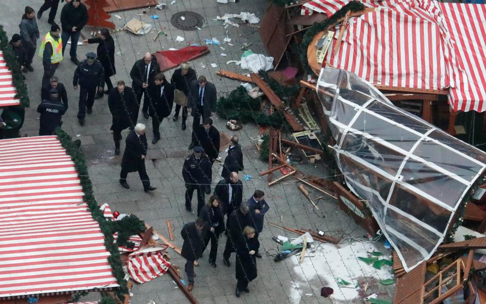  She was taken to the scene where the blood of a victim remained on the market pavement
