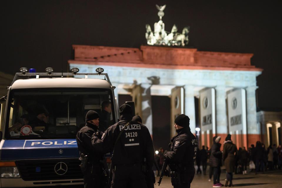  Cops stand guard in front of the Brandenburg Gate tonight