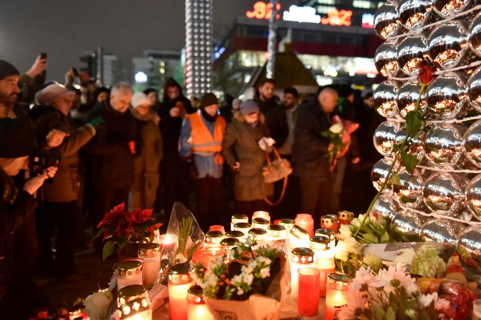  Mourners gathered a day after the viscous attack on the shoppers at the Christmas market