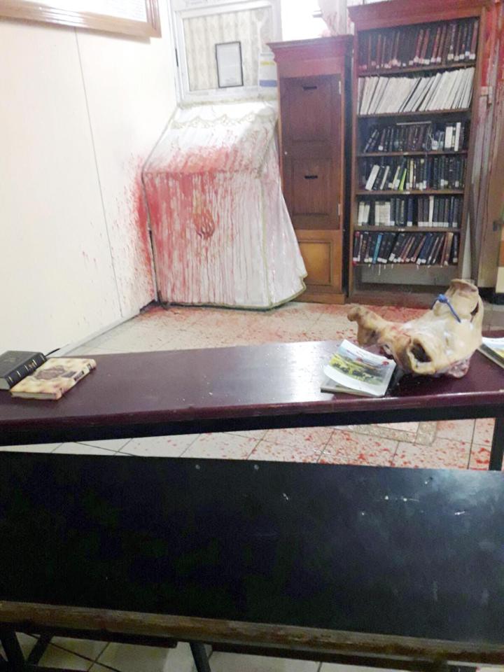 It is claimed the raiders also drew a swastika on the wall of the synagogue 