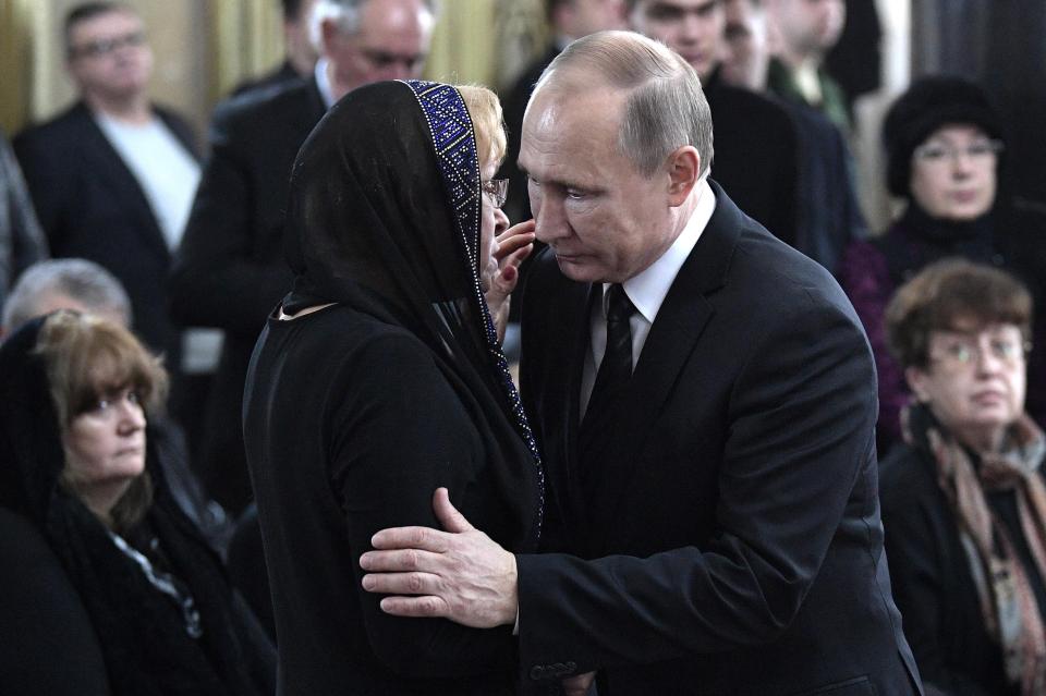 Vladimir Putin consoles the widow of diplomat Andrei Karlov