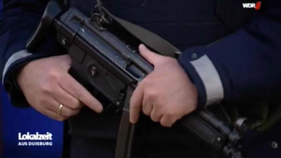 Local media posted the video of the heavily-armed cop at a market in Moers, Germany
