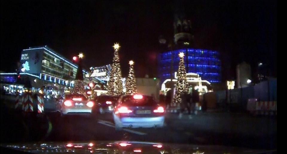 Seconds later people can be seen running away from the attack which claimed 12 lives