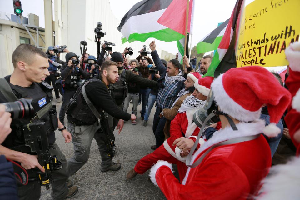 Israeli soldiers clash with Palestinian protesters during a demonstration against Israel's controversial separation barrier in the West Bank