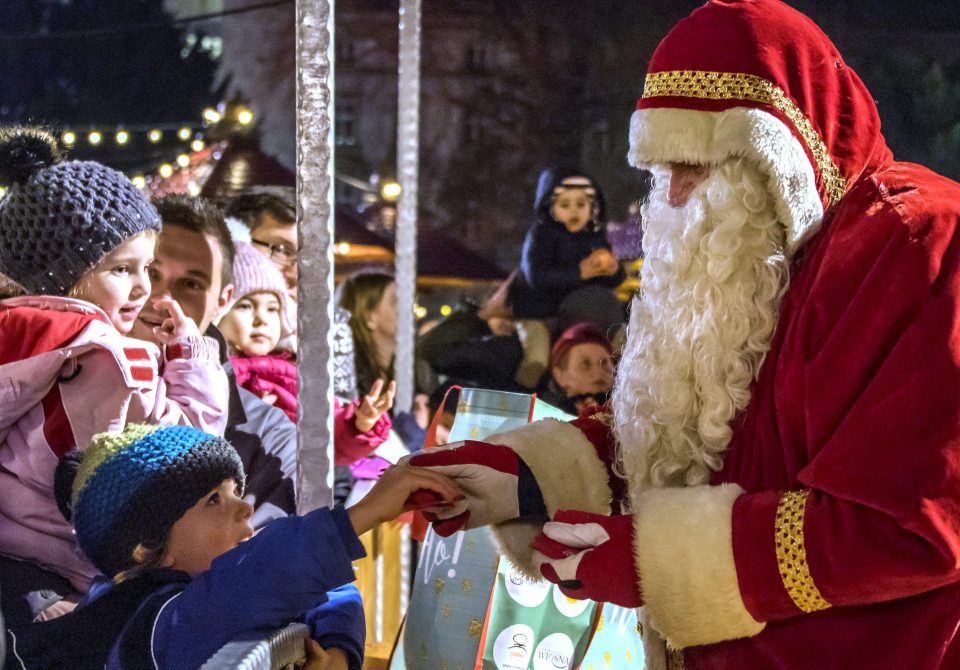 Children got to meet Santa after his festive stunt of soaring above the market