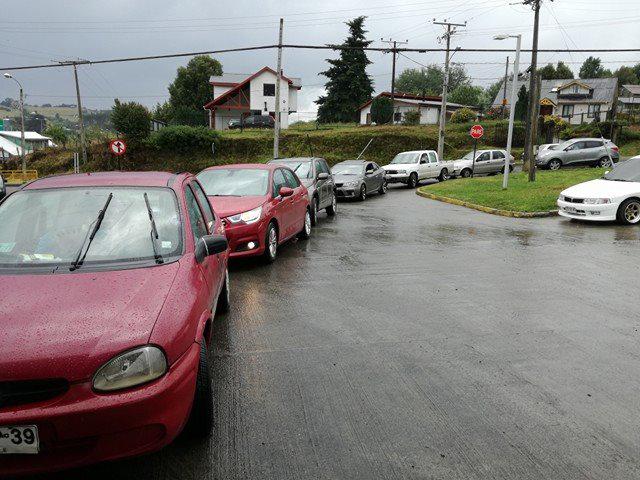  Cars queue to fill up with gas in the coastal city of Castro, Chiloe Island
