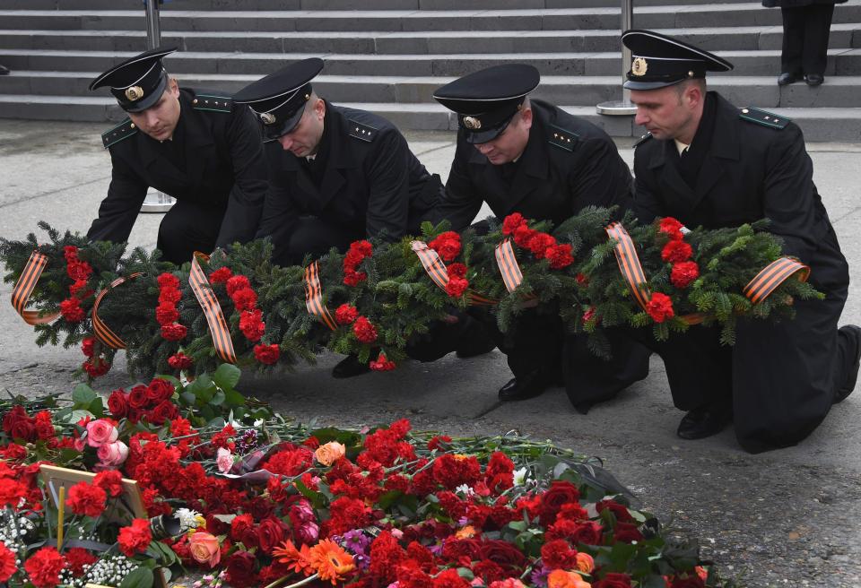 Tributes have been laid in Sochi while rescue teams work just off the shore 