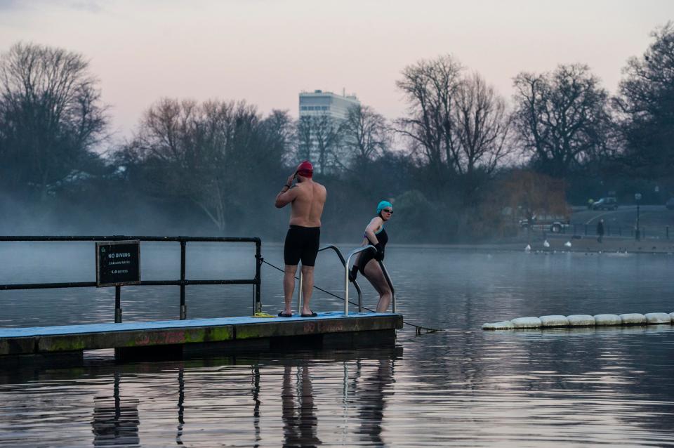  Swimmers brave the cold weather at The Serpentine Lido in Hyde Park, London, between Christmas and New Year