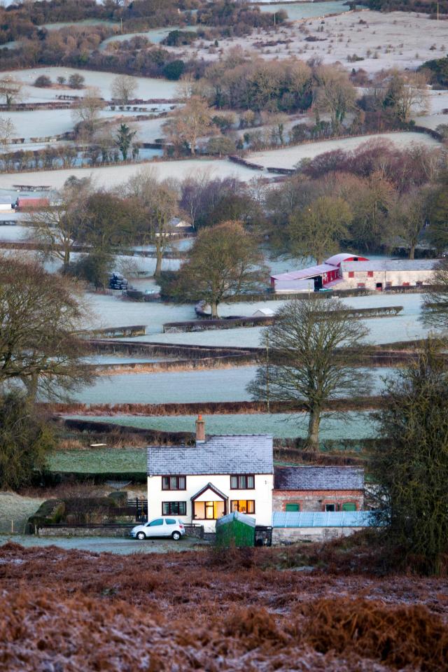  Frosty fields surround a cosy looking farmhouse in north Wales as temperatures plummet for most of the UK