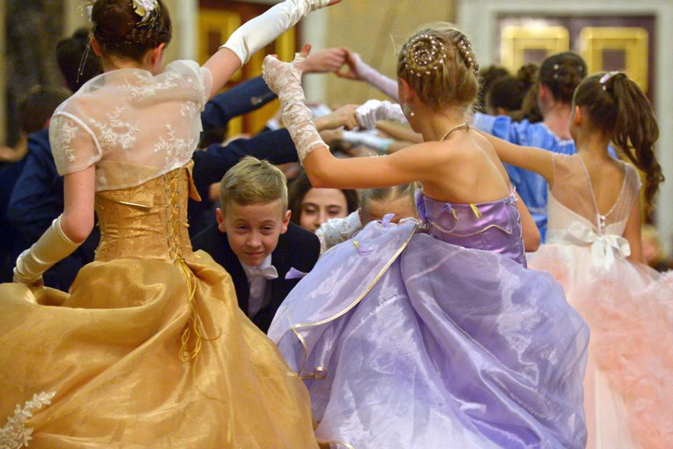  The youngsters can be seen paired up to perform ballroom dance