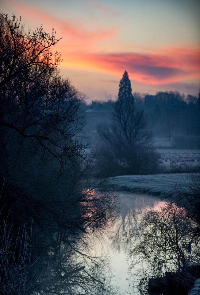  A stunning sunrise is a suitable backdrop for a picturesque wintry scene