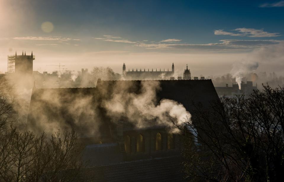  Fog swirled over the roofs of Cambridge's historic buildings this morning as the warm Christmas weather faded