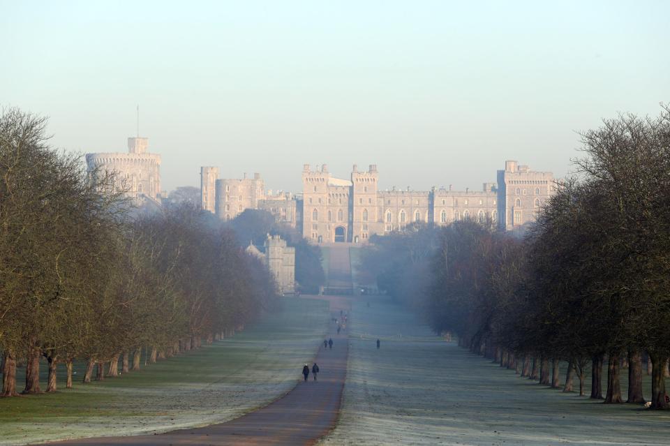  The Long Walk up to the entrance of Windsor Castle as it looms out of the fog on a sunny wintry day