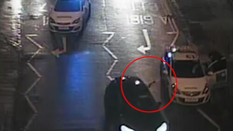 Cops have arrested a 21-year-old man after shots were fired at a police car in Bradford