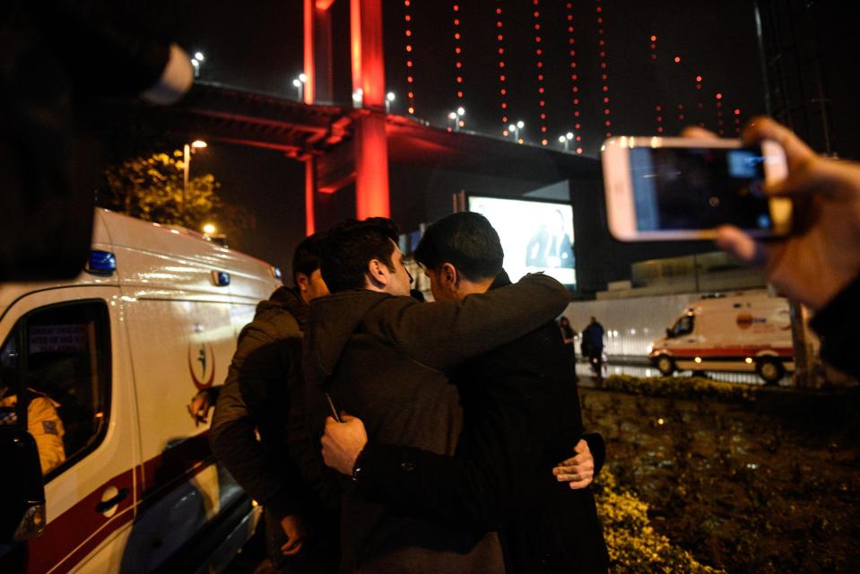 Survivors were seen comforting each other outside the nightclub in Istanbul