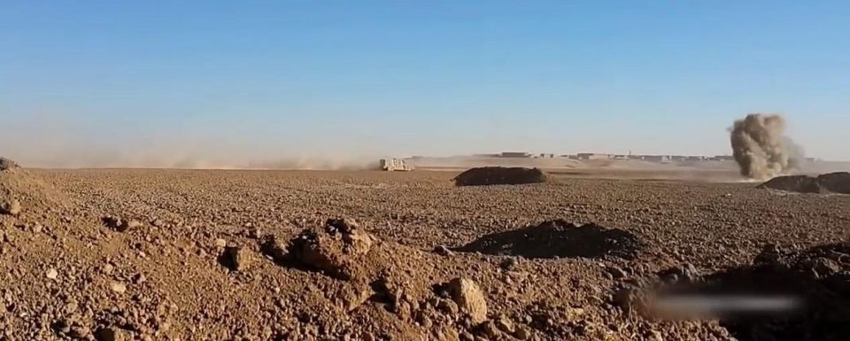  Shia militias shoot at the car as it hurtles through the dusty landscape although its intended target is not clear