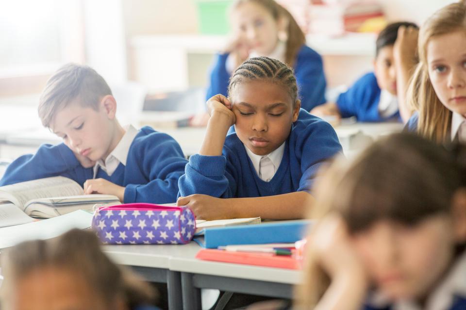 School kid falling asleep during class 