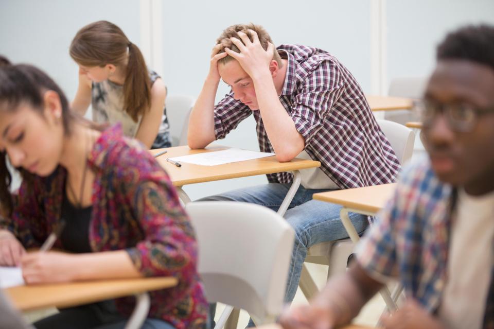 school kid sitting at desk 