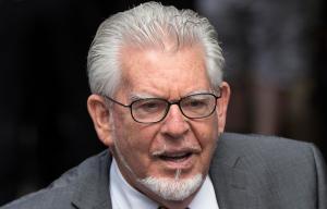 Rolf Harris appears in court via video link accused of sex attacks on girls including one aged under 13