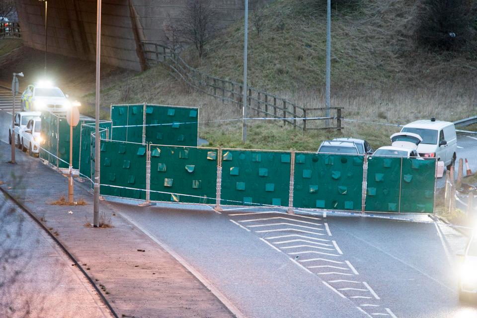 The road remains closed this morning as police screen off the scene of the shooting 