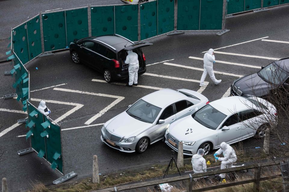 Forensic teams continue to work at the scene with police warning the road will remain closed for several more hours