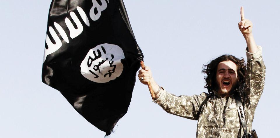  ISIS militants parade in 2014 in Raqqa, Syria